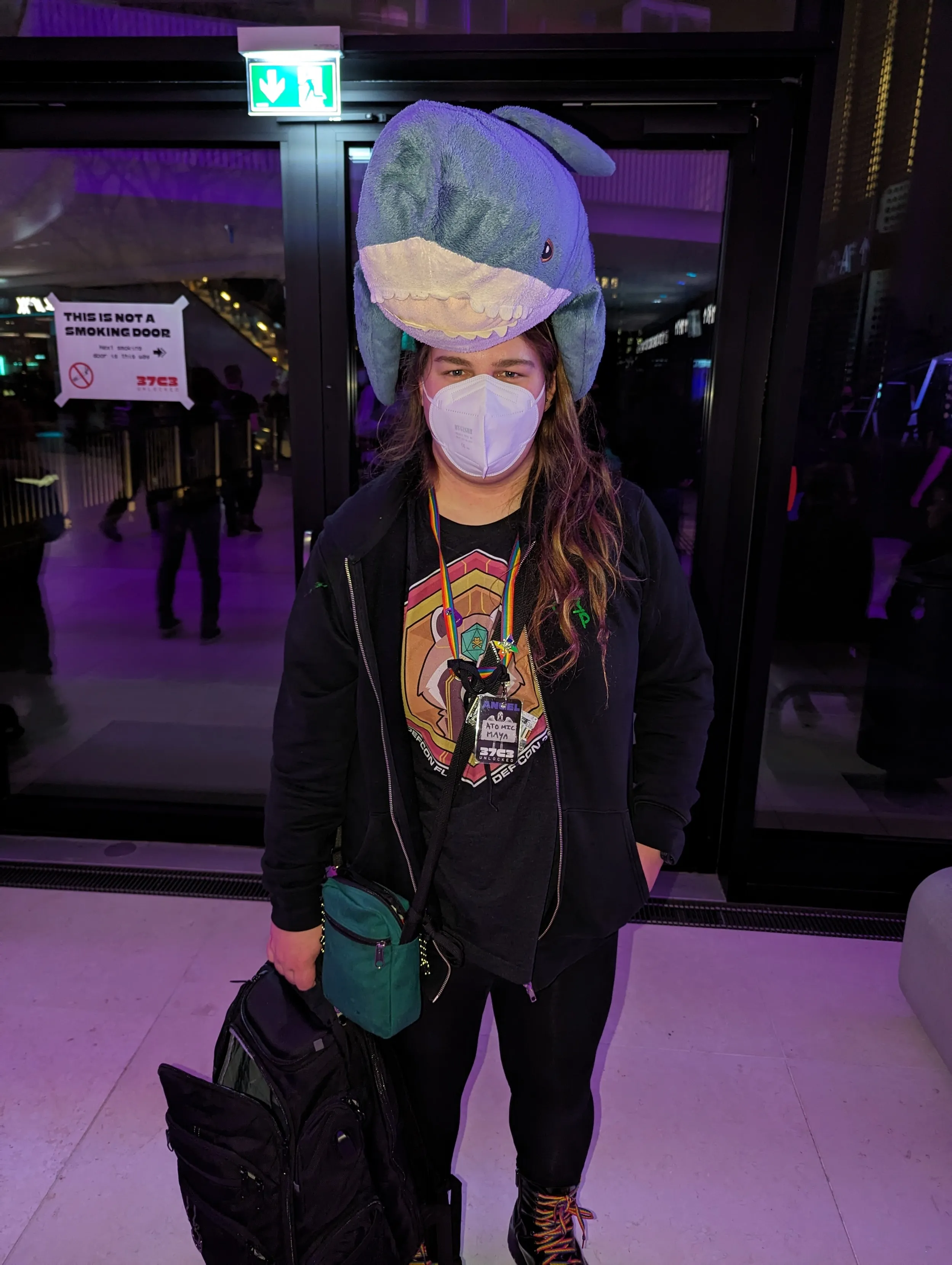 Maya, with a shark plushie on her head