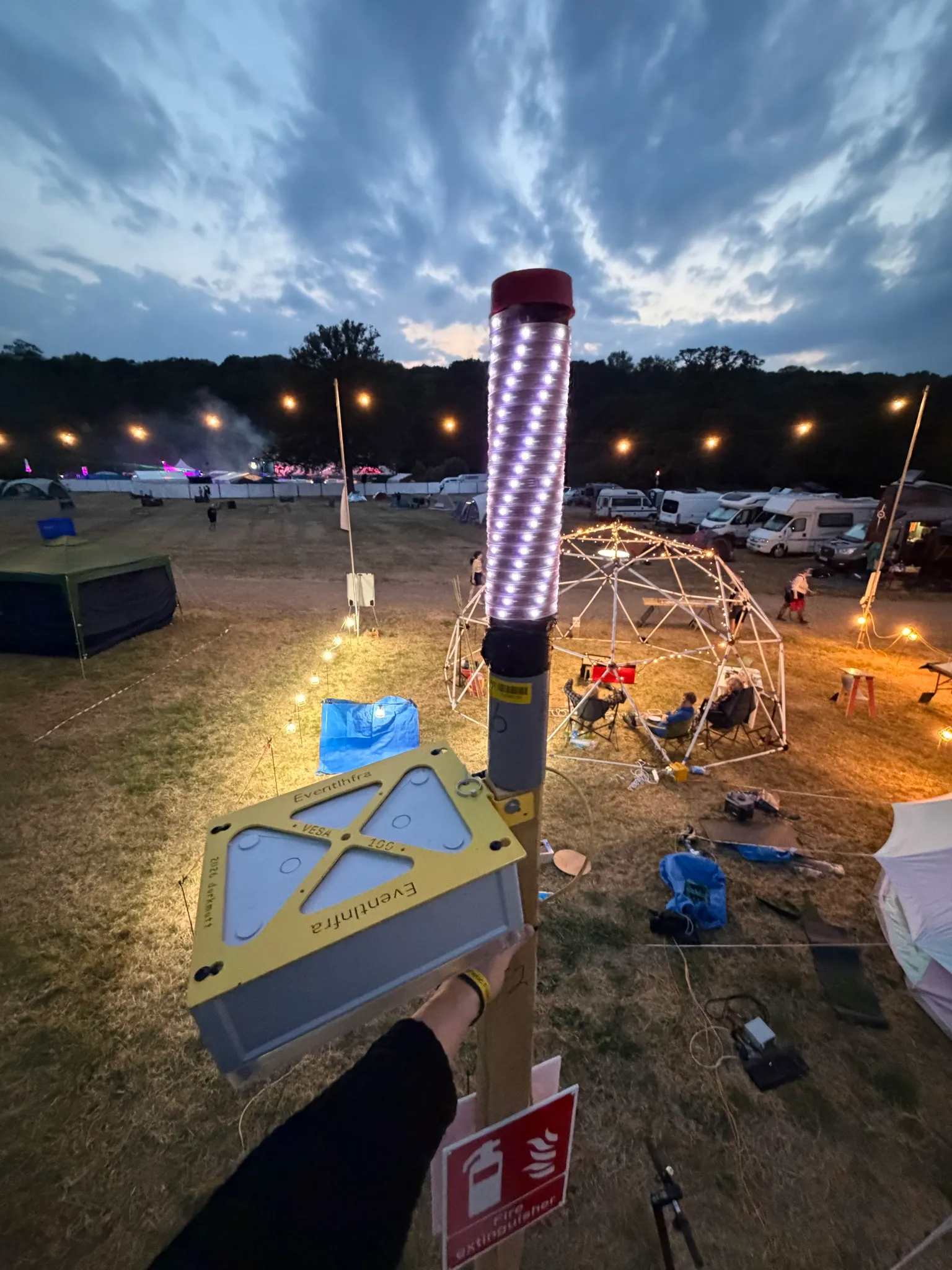 picture taken from the top of a datenklo. one can see the ohm-light being unhappy (all white = no uplink) but the background is full of things and tents being set up.