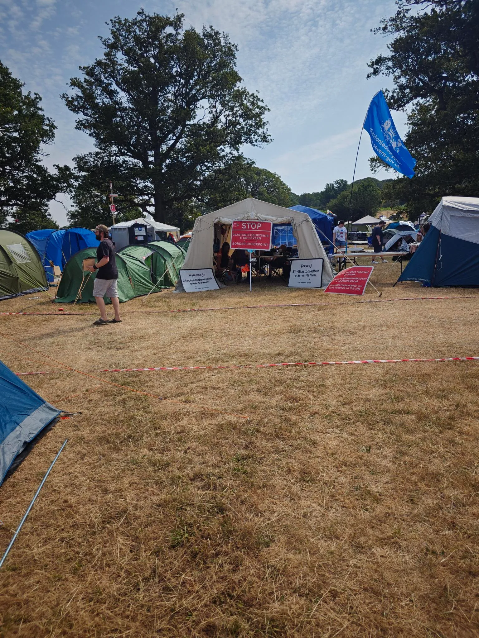 picture of the entrance tent / border checkpoint for entry to the glastonledburyshire-on-severn village