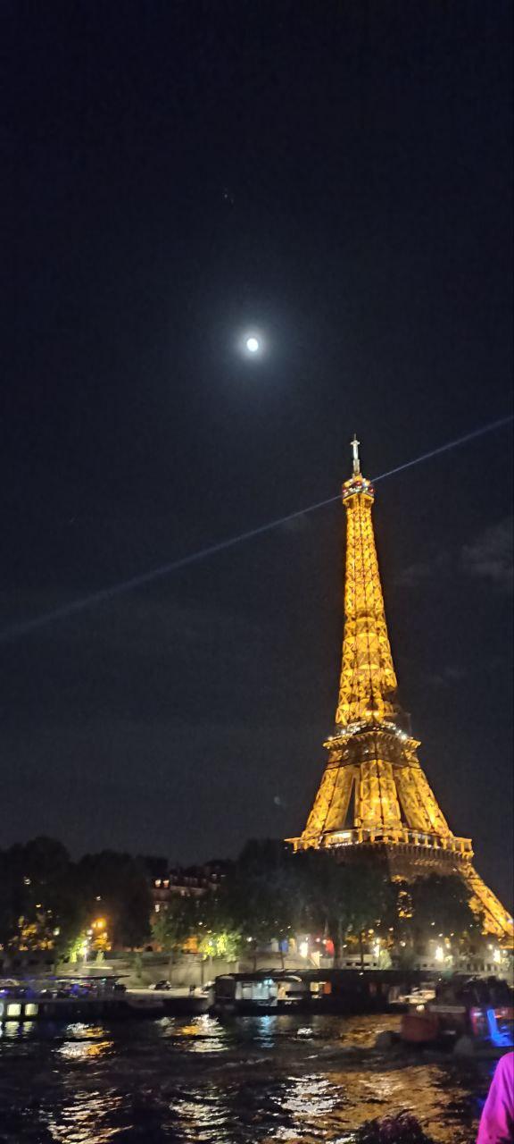 The Eiffel Tower, illuminated at night