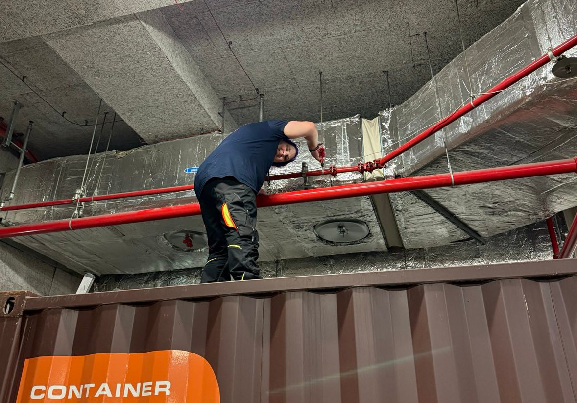 picture of maya standing on top of a shipping container