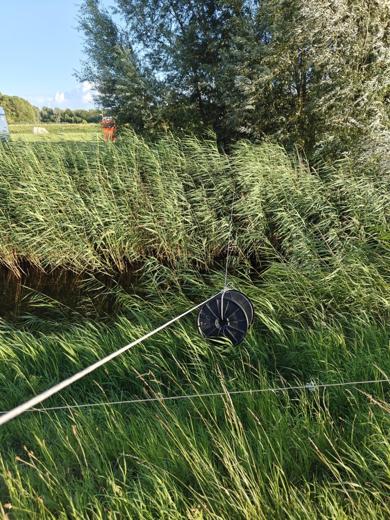 the flooded area next to the hill