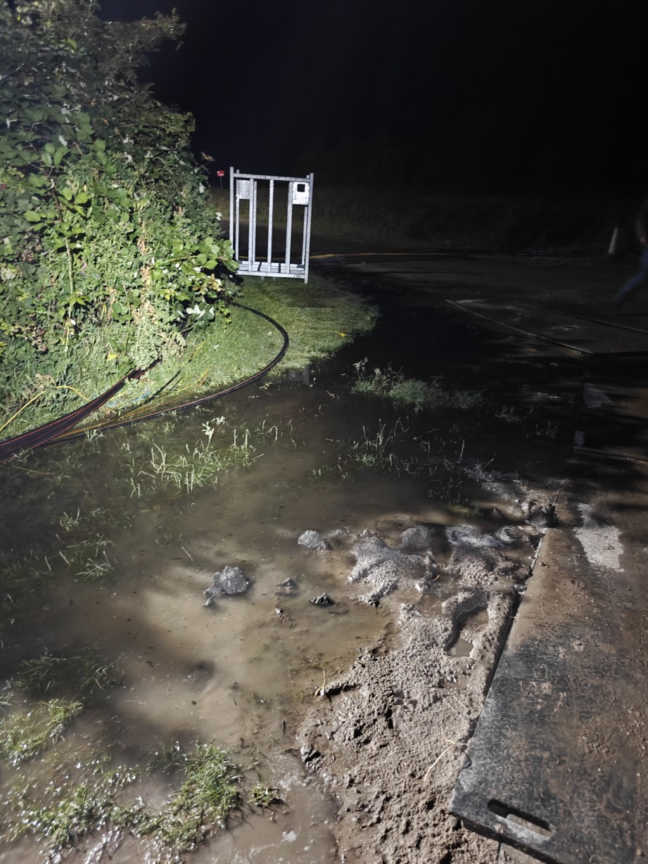 the flooded area next to the hill